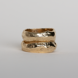 Two Dune Bands in yellow gold stacked together, showing the molten surface